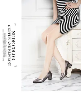 Elegant gunmetal gray metallic pumps featuring a pointed toe and chunky block heel design