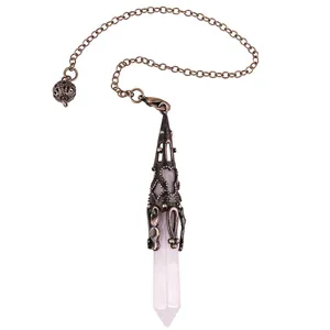 Detailed macro view of hexagonal rose quartz pendulum with antique bronze filigree