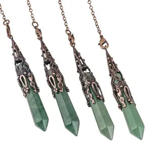 Detail of natural green stone hexagonal pendants with ornate antique copper caps