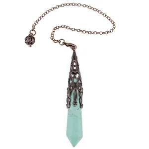 Detail view of turquoise hexagonal crystal pendulum with ornate bronze cap and chain