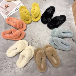 Detailed top view of plush cross-strap slippers arranged in a circle in multiple colors