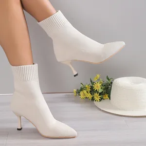 Elegant white knitted stiletto ankle boots with pointed toe and ribbed cuff for women