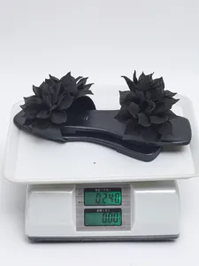Detailed weight verification showing 0.240 kg for black flat sandals with floral decor