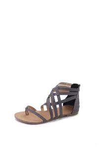 High-quality side profile of grey strappy braided toe loop gladiator flat sandals.