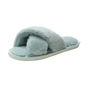 Detailed macro view of soft light blue cross-strap furry slipper with plush texture