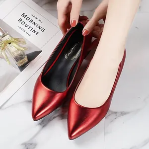 Elegant red metallic pointed-toe chunky heel pumps for a retro French chic style.