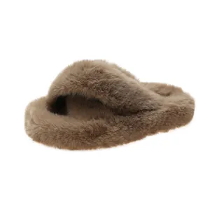 Macro view of plush cross-strap faux fur slippers with comfortable thick sole