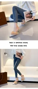 Detailed view of pointed-toe high heel mules featuring elegant rabbit fur and metal tips