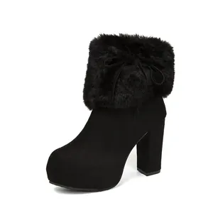 Black block heel ankle boot with faux fur collar and platform sole for winter warmth