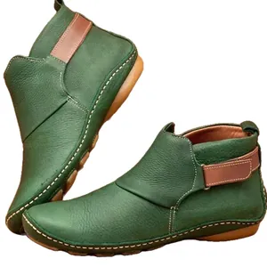 Vintage green leather ankle boots for women with comfortable flat soles and velcro straps
