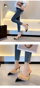Close-up detail of sexy pointed-toe high-heel mules with rabbit fur and metal cap
