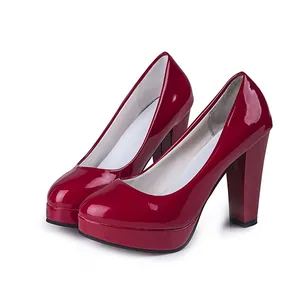 Elegant red patent leather platform pumps featuring chunky high heels and round toe design