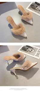 Elegant pointed toe stiletto heel mules featuring luxurious rabbit fur trim and metal toe cap detail