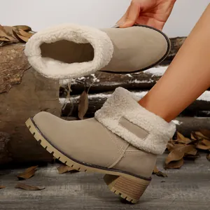 Detail of women's tan suede winter boots with warm faux fur lining and chunky sole