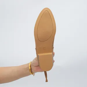 Detail view of the durable non-slip sole on women's pointed toe ankle boots, size 37