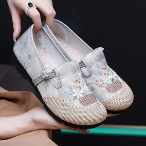 Detailed view of traditional Chinese ethnic embroidered loafers with soft soles