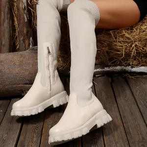 Elegant beige over-the-knee knit boots with chunky platform sole and side zipper