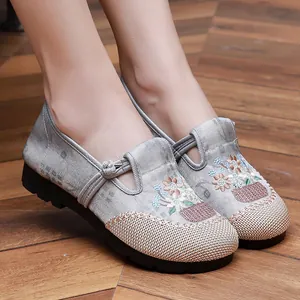 Detailed view of traditional Chinese embroidered floral shoes with soft sole design