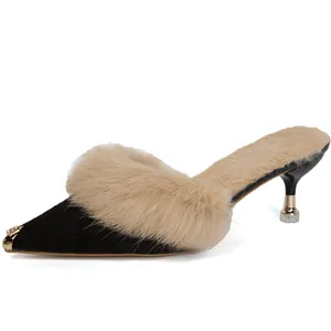 Elegant pointed-toe kitten heel mules with fluffy rabbit fur and rhinestone metal toe cap.