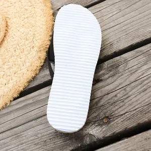 Detailed macro view of white anti-slip ripple texture sole on summer beach flip-flops