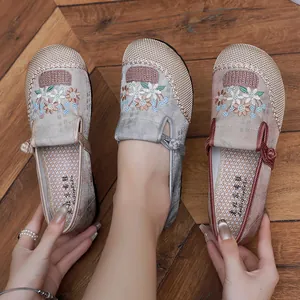 Close-up detail of traditional Chinese ethnic embroidered cloth shoes with floral patterns