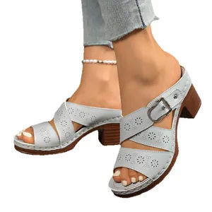 Stylish women's grey hollowed-out sandals with chunky heels and elegant buckle straps