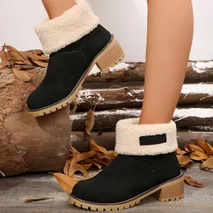 Side view of women's black winter boots with cream fleece cuffs and chunky heels