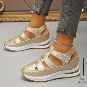 Detailed view of women's champagne wedge sandals with 7cm platform heel.