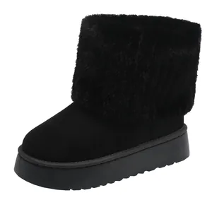 Detailed view of women's black platform snow boot with a cozy plush faux fur cuff design