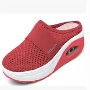 Close-up view of red mesh platform mule shoes featuring a comfortable air cushion sole