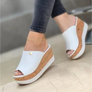 Stylish white women's wedge sandals featuring cork texture platform and open toe design