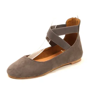 Grey suede ballet flats featuring elegant elastic criss-cross ankle straps for comfort