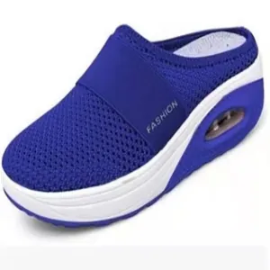 Side detail of women's blue mesh mule with white platform air cushion sole