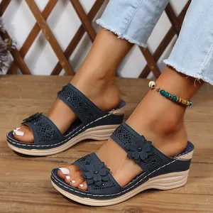 Blue wedge sandals for women with decorative flowers and sparkling rhinestone accents