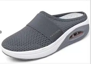 Detailed side view of grey mesh breathable mules with thick air cushion platform sole