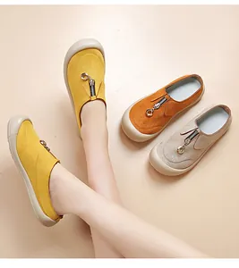 Close-up of comfortable women's casual platform shoes with decorative front zipper