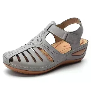 Comfortable grey vintage wedge sandals for women with stylish laser-cut hollow design details