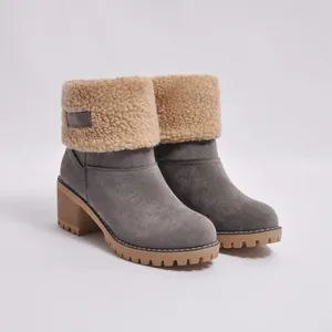 Grey suede-like women's snow boots with beige shearling cuff and robust block heel