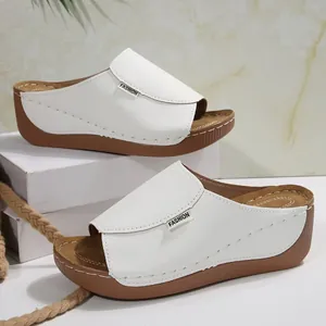 Comfortable white women's platform wedge slide sandals featuring casual thick soles and fashion labels