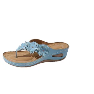 Stylish light blue wedge thong sandals for women featuring elegant flower accents and rhinestones
