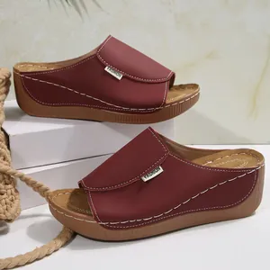 Stylish burgundy wedge platform sandals for women featuring white contrast stitching