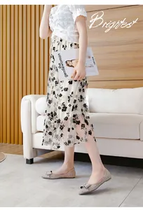 Close-up of sparkling pointed-toe flats with a bow in a stylish lifestyle setting