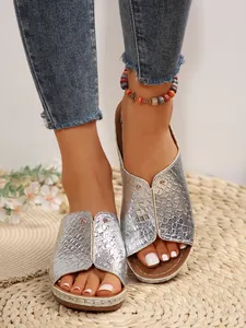 Close-up of silver snakeskin pattern platform slide sandals for women's summer fashion