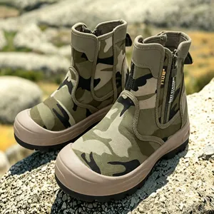 Detail view of camouflage outdoor combat boots with side zipper and rugged sole