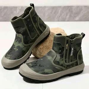 Close-up of camouflage outdoor tactical boots featuring side zippers and rugged soles.