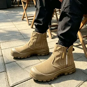 Detailed view of tan outdoor tactical boots featuring side zipper and rugged lug sole