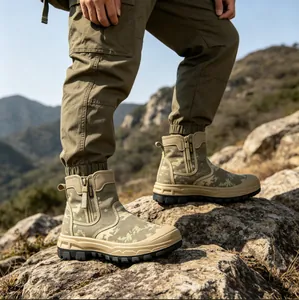Professional side view of camouflage outdoor combat boots worn by a hiker on rocky terrain