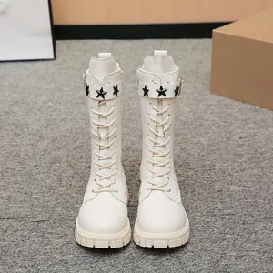 Beige mid-calf Martin boots for girls with lace-up front and star rivet strap details