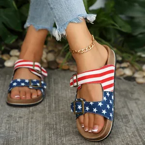 Close-up of patriotic US flag patterned cork sandals with adjustable metal buckles