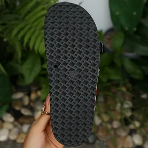 Detailed view of durable non-slip black sole on US flag themed slide sandal with size 37 mark